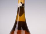 an image of a bottle of wine sitting on top of a table