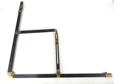 an image of a pair of black and gold square brackets on a white surface