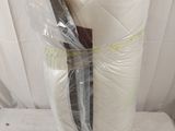 two rolls of toilet paper wrapped in plastic on a table