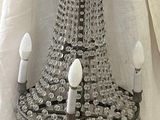 a chandelier that is hanging from the ceiling