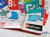 several children ' s books with pictures of animals and letters on them
