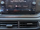 the dashboard of a car with a radio and a remote control
