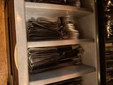 a refrigerator filled with lots of utensils and silverware