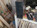 an image of a computer and other electronics in a garage