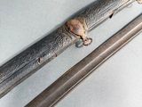 a close up of a pair of swords on a table