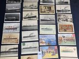some old postcards of ships and ships are on a table