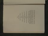 a book open on a table with a black background