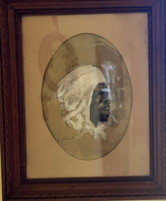 painting of a man in a turban in a frame on a wall