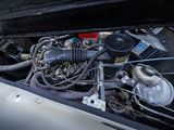a close up of a car ' s engine with its hood open