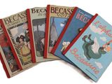 six livres pour enfants sont alignés sur une surface blanche