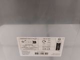 a close up of a white refrigerator with a label on it