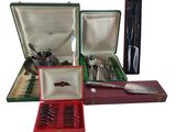 many different types of silverware in a case