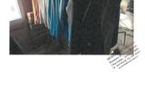 a picture of a rack of clothes in a room