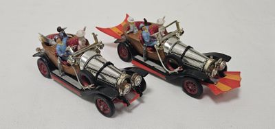 two toy cars that are sitting on a table