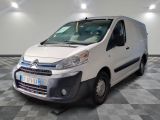 the white van is parked on a checkered floor in a room
