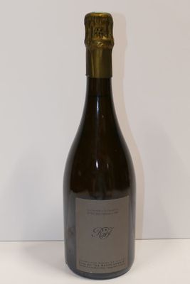 a bottle of wine that is sitting on a table