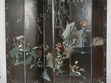 an image of a room divider with a bird and flowers painted on it