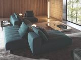 a living room with a couch, coffee table and a large window