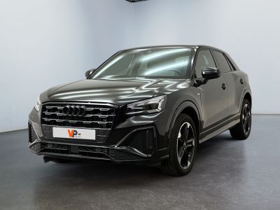 a grey audi suv parked in a large room with a black floor