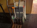 a hand truck that is sitting in the middle of a room