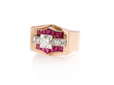 a close up of a diamond and ruby ring on a white background