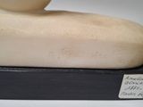 a sculpture of a foot that is sitting on a table