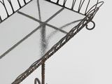 a metal tray with a glass top on a stand