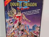 the box of the game double dragon is sitting on the table