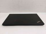 a black laptop on a white table with a white background