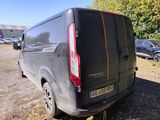 a van that is parked on the side of the road