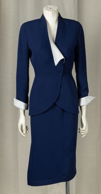 an image of a mannequin wearing a blue suit and white shirt