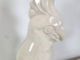 a white bird that is sitting on top of a table