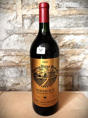 a bottle of wine that is sitting on a table