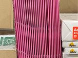 a pile of pink straws in a cardboard box