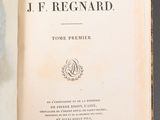 an open book with a picture of a man on it