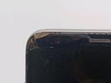 a close up of a cell phone with a broken screen