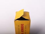 a yellow box with a yellow lid sitting on a table
