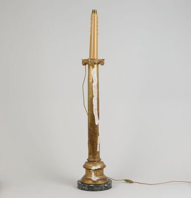 pair of brass and marble candlesticks on a marble base