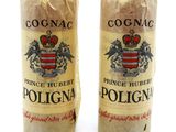 pair of two bottles of wine sitting next to each other on a white surface