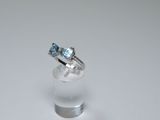 an image of a white gold ring with a blue topaz stone