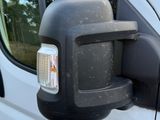an image of a side view mirror of a van