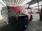 a large red truck parked inside of a building