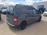 a grey van that is parked in a lot