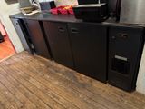 an image of a kitchen with a refrigerator and a microwave