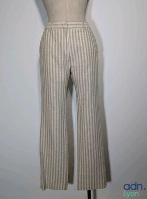 an image of a mannequin with a white shirt and striped pants