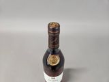 an image of a bottle of liquor sitting on top of a table