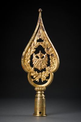 an image of a gold and black clock on a stand