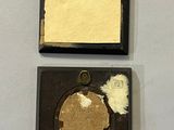 two pieces of paper and a piece of paper on a white surface
