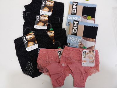 three pairs of underwear that are sitting on a table