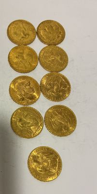 a lot of gold coins that are on the table